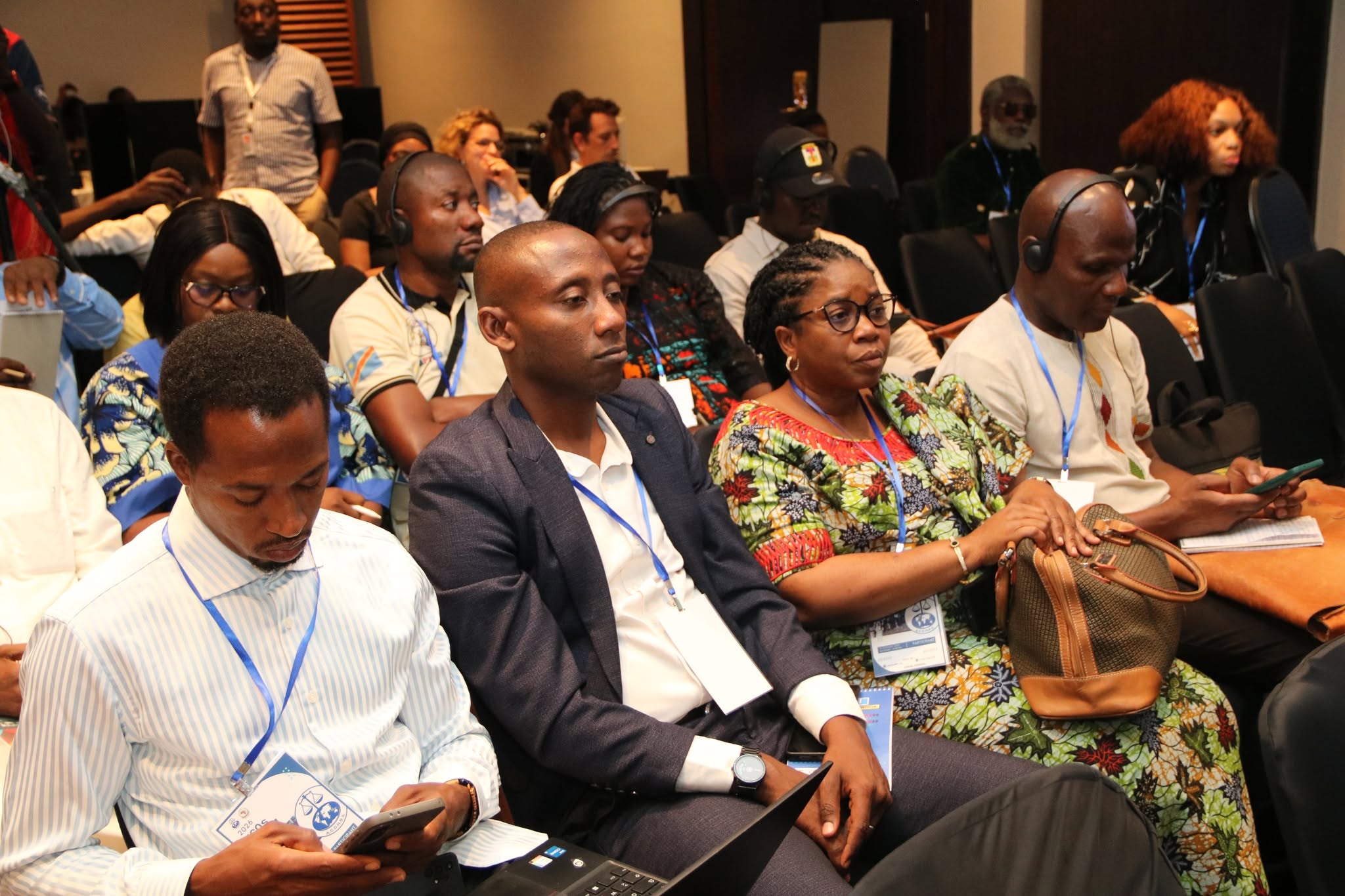 Delegates taking notes during the panel at the NGOs Forum
